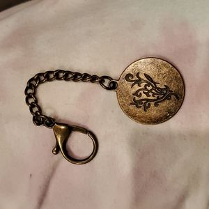 Younique  key ring or purse accessory.